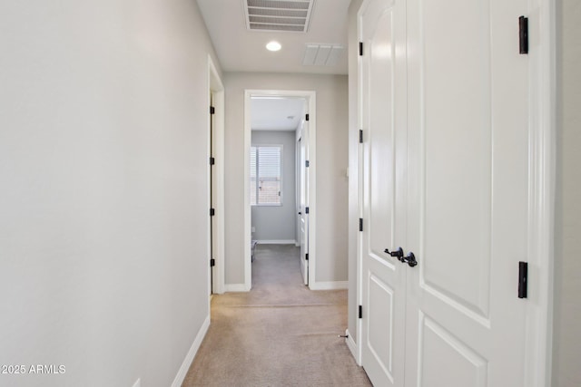 hallway with light carpet