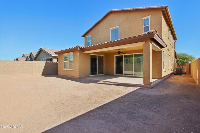 back of house featuring cooling unit, a patio area, and ceiling fan