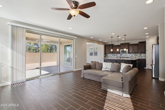 living room featuring ceiling fan