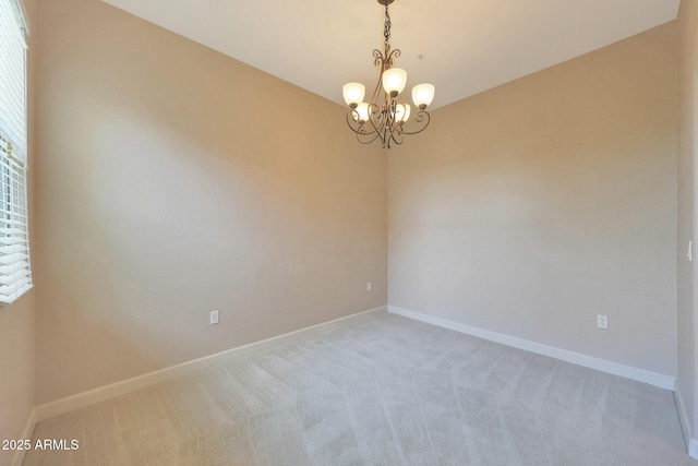 20750 N 87th St Unit 2062, Scottsdale, AZ 85255 - carpeted spare room featuring a chandelier, baseboards, and healthy amount of natural light