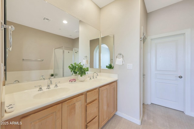 20750 N 87th St Unit 2062, Scottsdale, AZ 85255 - full bathroom with a shower stall, double vanity, and baseboards