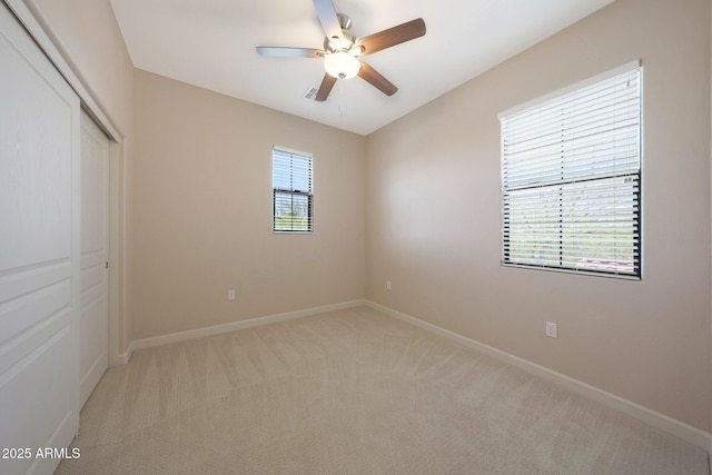 20750 N 87th St Unit 2062, Scottsdale, AZ 85255 - unfurnished bedroom with a closet, light colored carpet, baseboards, and ceiling fan