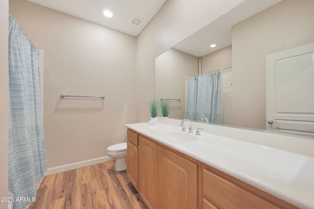 20750 N 87th St Unit 2062, Scottsdale, AZ 85255 - bathroom featuring wood finished floors, vanity, toilet, baseboards, and curtained shower
