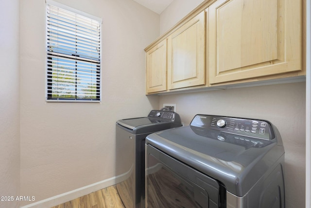 20750 N 87th St Unit 2062, Scottsdale, AZ 85255 - laundry area featuring cabinet space, separate washer and dryer, baseboards, and light wood finished floors
