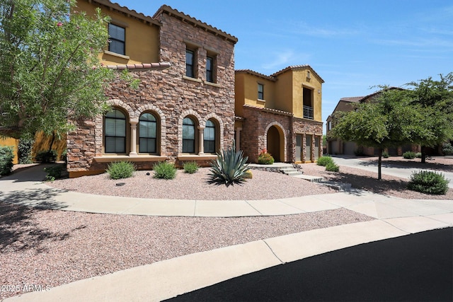 20750 N 87th St Unit 2062, Scottsdale, AZ 85255 - mediterranean / spanish home with stucco siding, a tile roof, and stone siding