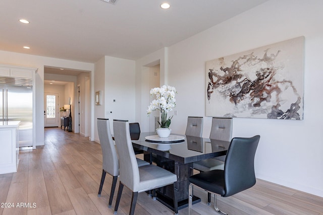 dining room with light hardwood / wood-style flooring