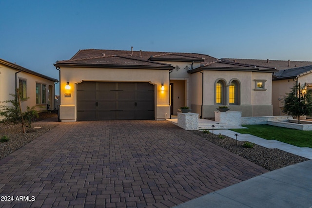 view of front of property with a garage