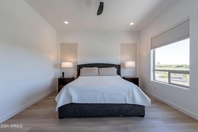 bedroom featuring ceiling fan and light hardwood / wood-style floors