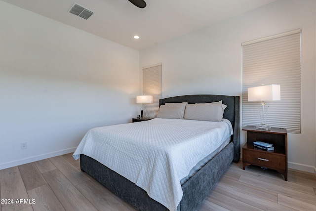 bedroom with hardwood / wood-style floors and ceiling fan