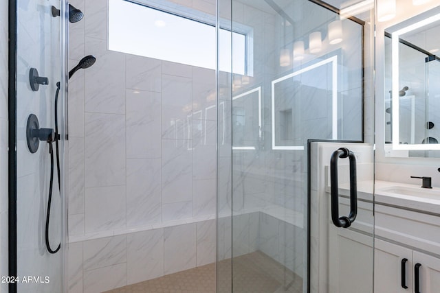 bathroom featuring an enclosed shower and oversized vanity