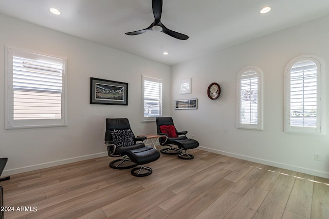 sitting room featuring light hardwood / wood-style flooring and ceiling fan