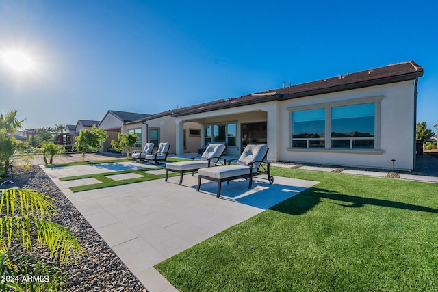 exterior space with a patio and a lawn