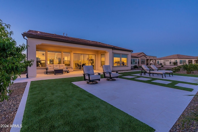 exterior space featuring a patio, an outdoor living space, and a yard