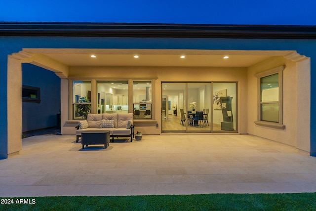 patio terrace at twilight with an outdoor living space