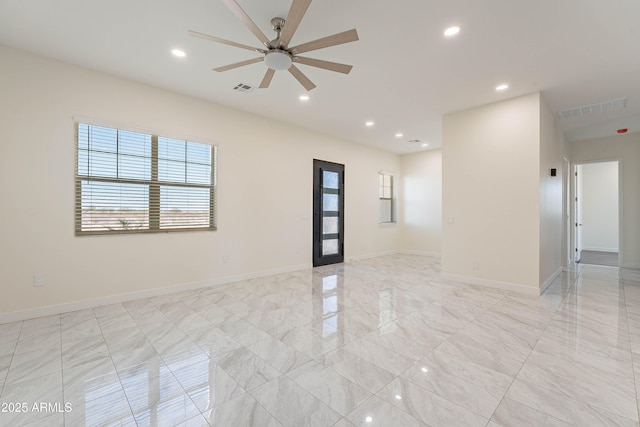 empty room featuring ceiling fan