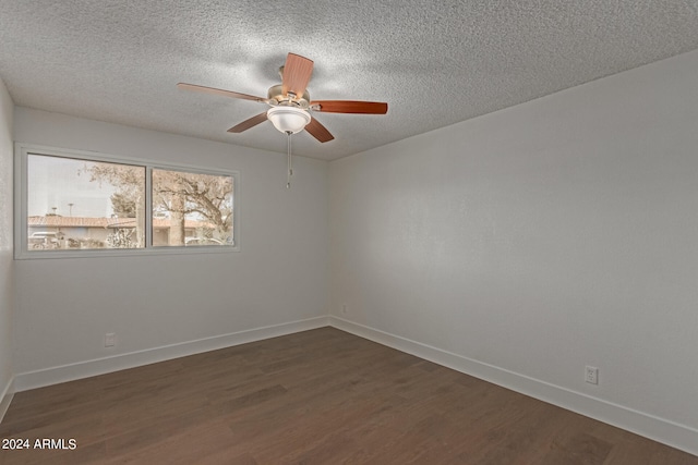 unfurnished room featuring ceiling fan, a textured ceiling, and dark wood-type flooring