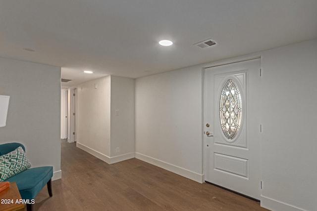 foyer entrance with dark hardwood / wood-style flooring