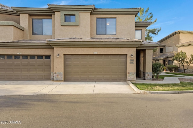 view of property with stucco siding and an attached garage