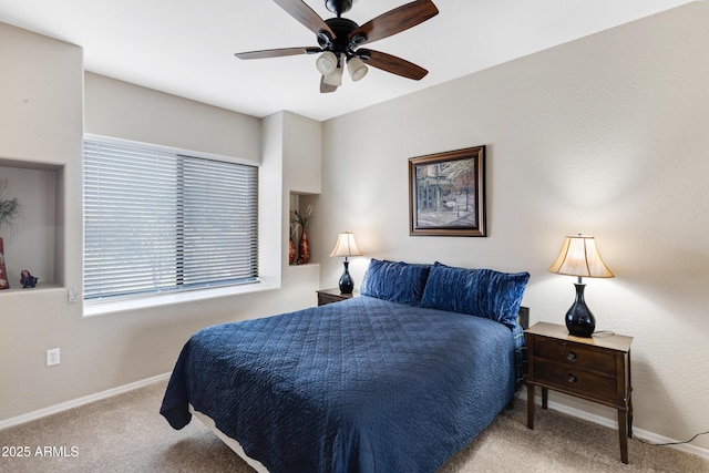 bedroom featuring carpet floors, baseboards, and a ceiling fan