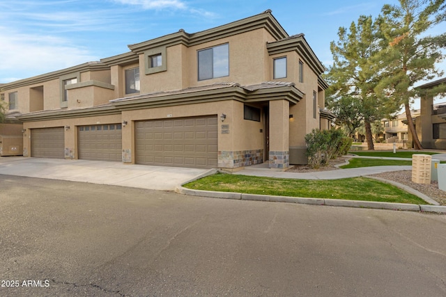 multi unit property with concrete driveway, stone siding, a tiled roof, an attached garage, and stucco siding