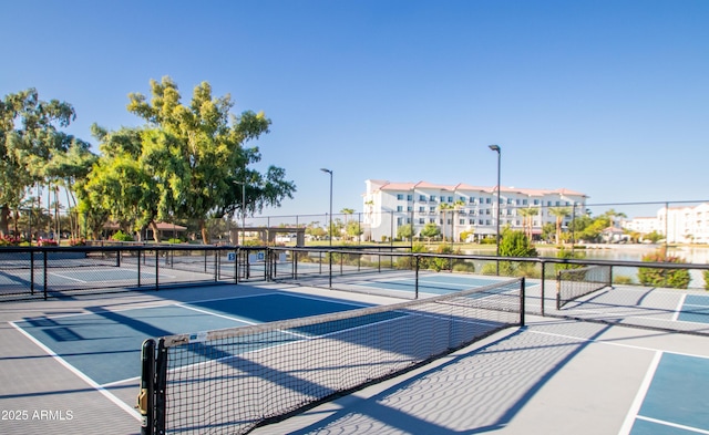 view of sport court with fence