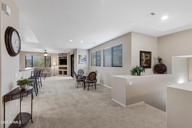 interior space with baseboards, visible vents, ceiling fan, carpet flooring, and recessed lighting