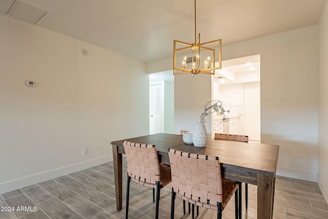 dining space featuring a notable chandelier