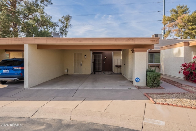 view of front of house with a carport