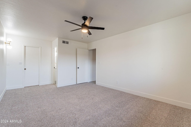 unfurnished bedroom with carpet flooring, a closet, and ceiling fan