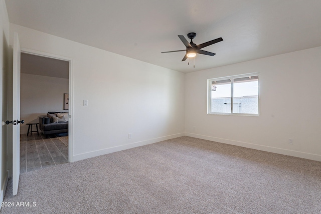 empty room with carpet floors and ceiling fan