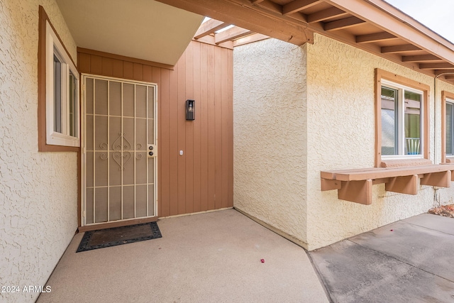 doorway to property with a patio area