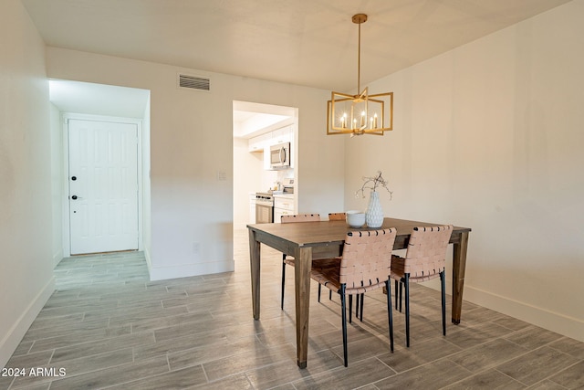 dining space featuring a chandelier