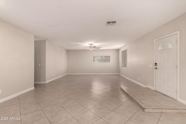 unfurnished room featuring visible vents, ceiling fan, and light tile patterned floors