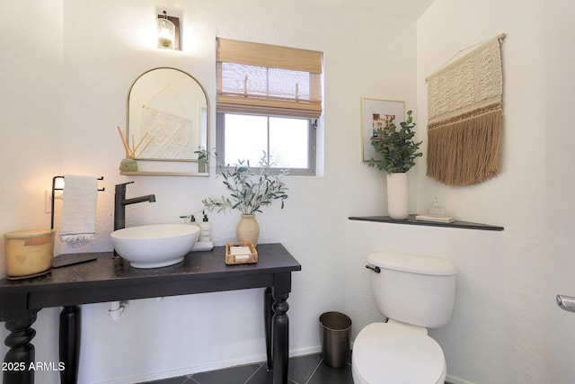 bathroom featuring toilet and sink