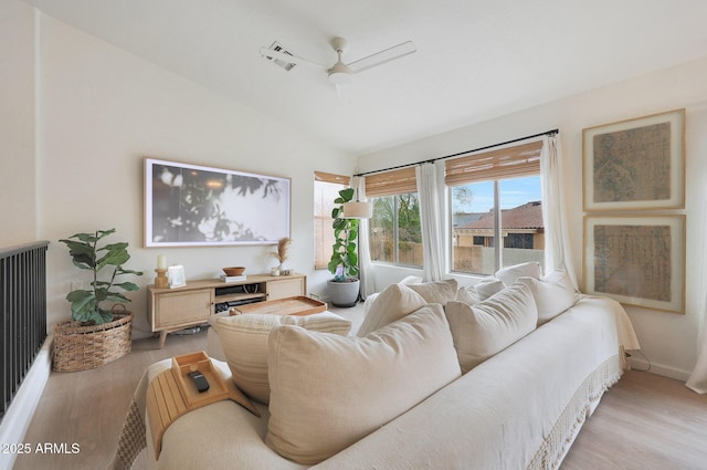 living room with ceiling fan and light wood-type flooring