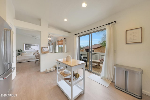 interior space featuring lofted ceiling and hardwood / wood-style floors