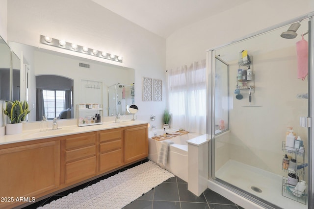 bathroom with tile patterned floors, plus walk in shower, and vanity