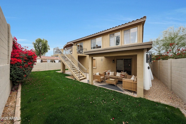 back of house with an outdoor living space and a lawn