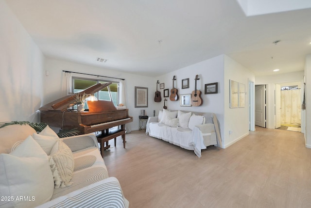 living room with light hardwood / wood-style flooring