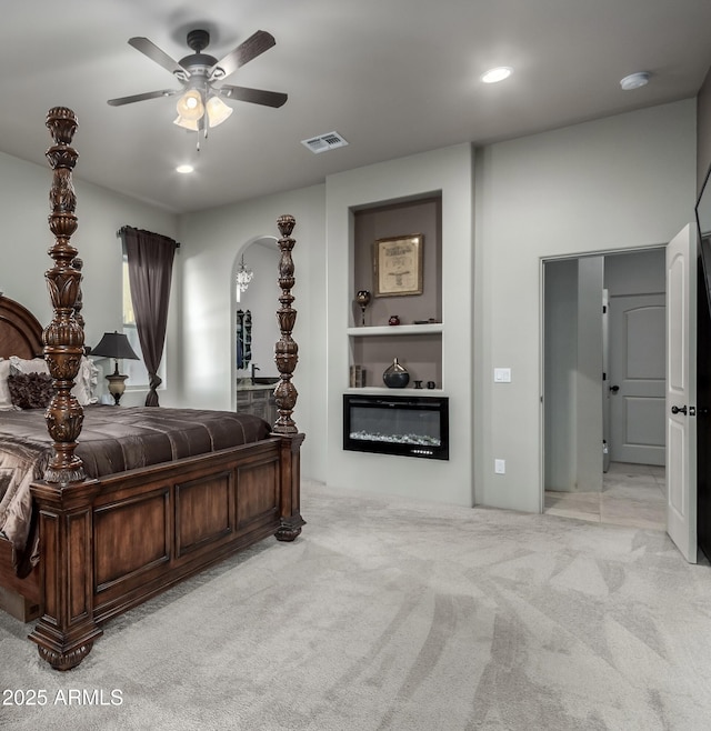 carpeted bedroom featuring ceiling fan