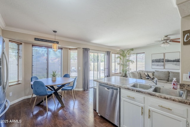 869 W Shellfish Dr, Gilbert, AZ 85233 - kitchen featuring stainless steel dishwasher, a sink, baseboards, dark wood-style floors, and white cabinets