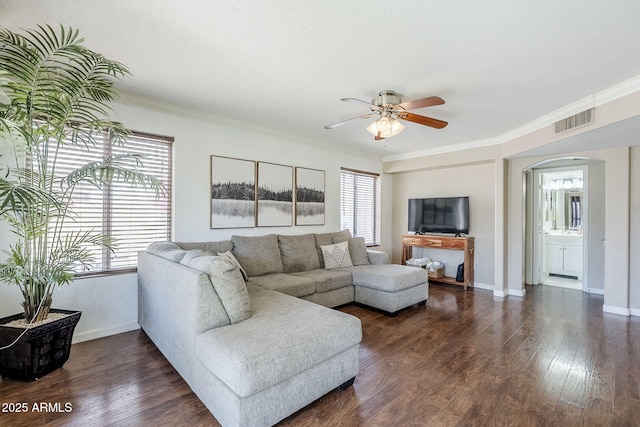 869 W Shellfish Dr, Gilbert, AZ 85233 - living area with arched walkways, a ceiling fan, dark wood-style floors, crown molding, and baseboards