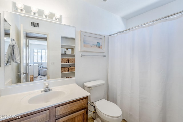 869 W Shellfish Dr, Gilbert, AZ 85233 - ensuite bathroom featuring vanity, toilet, and a shower with curtain