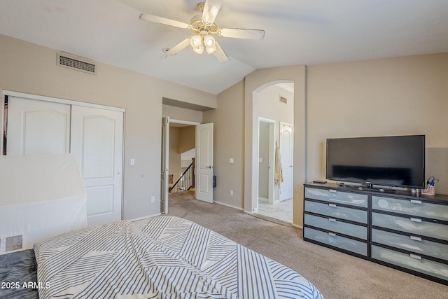 869 W Shellfish Dr, Gilbert, AZ 85233 - carpeted bedroom featuring arched walkways, lofted ceiling, a closet, ceiling fan, and baseboards