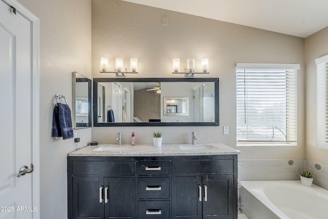 869 W Shellfish Dr, Gilbert, AZ 85233 - full bath with plenty of natural light, a bath, double vanity, and a ceiling fan