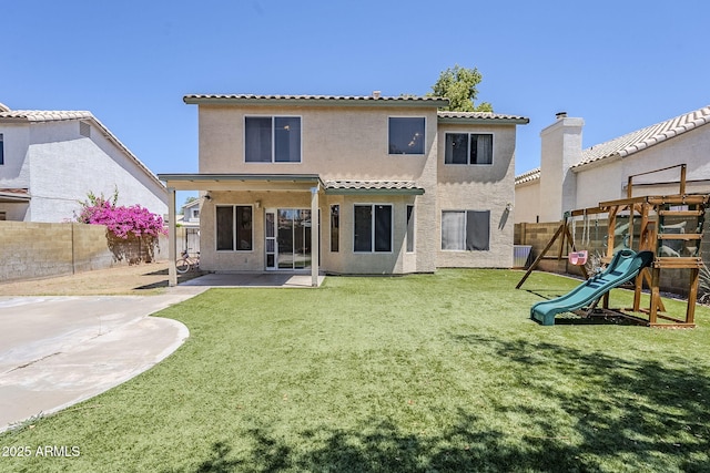 869 W Shellfish Dr, Gilbert, AZ 85233 - rear view of house featuring a playground, a patio, stucco siding, and a tiled roof