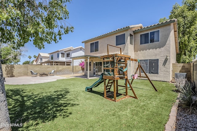 869 W Shellfish Dr, Gilbert, AZ 85233 - rear view of property with stucco siding, a patio area, a playground, a tile roof, and central air condition unit
