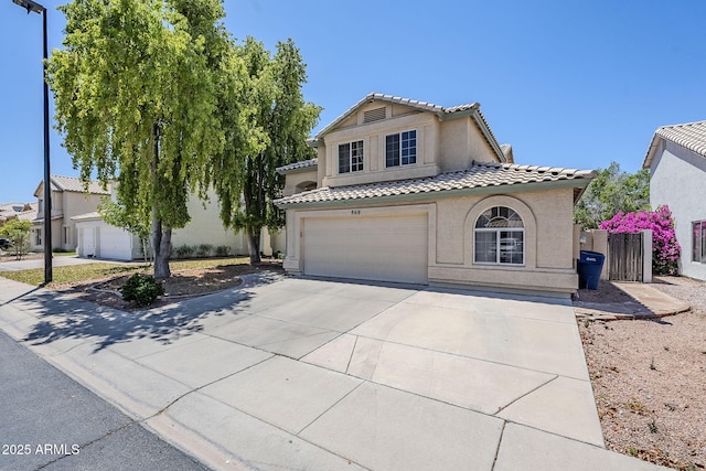 869 W Shellfish Dr, Gilbert, AZ 85233 - mediterranean / spanish-style house featuring a tile roof, a garage, stucco siding, and driveway