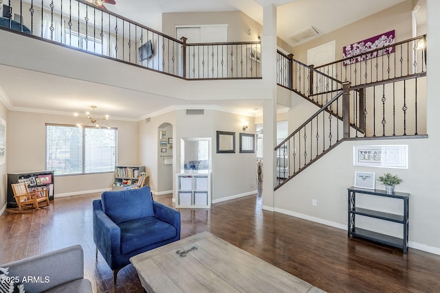 869 W Shellfish Dr, Gilbert, AZ 85233 - living area with wood finished floors, ornamental molding, baseboards, stairs, and a chandelier