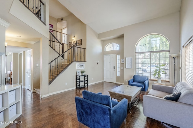 869 W Shellfish Dr, Gilbert, AZ 85233 - living room with a towering ceiling, dark wood-style floors, stairs, baseboards, and ornamental molding
